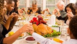 Picture of a family around Thanksgiving table